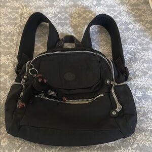 Chic Black Backpack with Silver Zippers